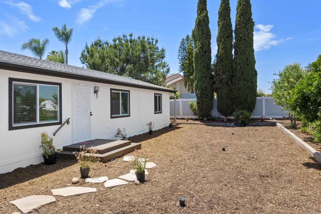 8620 Atlas View Drive Santee, CA 92071 - Photo 6 of 58 a backyard of a house with table and chairs