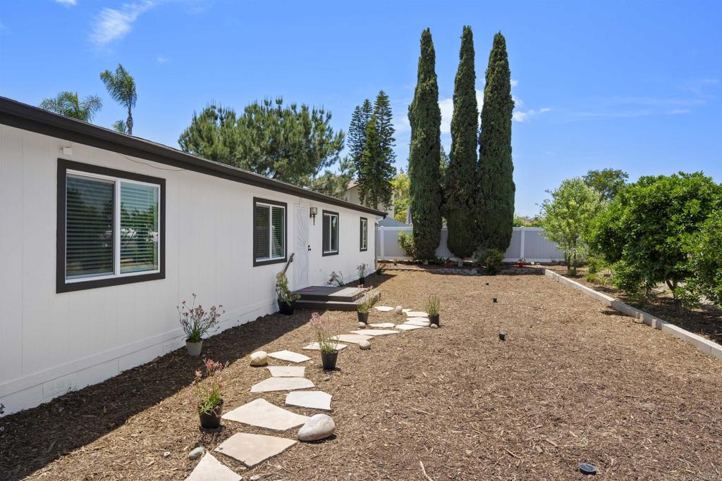 8620 Atlas View Drive Santee, CA 92071 - Photo 7 of 58 a front view of a house with a yard
