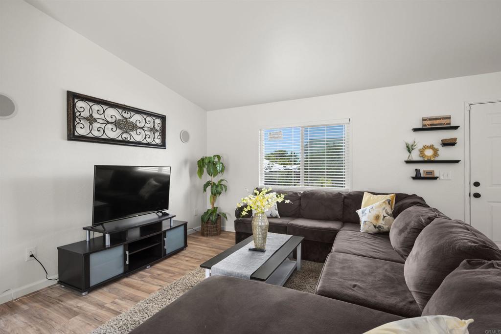 8620 Atlas View Drive Santee, CA 92071 - Photo 10 of 58 a living room with furniture and a flat screen tv