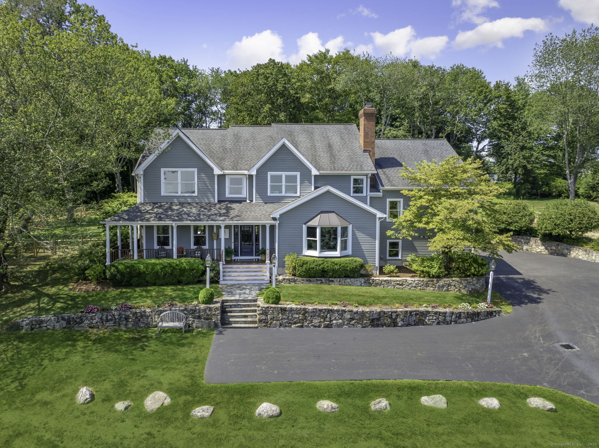 87 Catalpa Road Wilton, CT 06897 - Photo 1 of 1 a front view of a house with garden