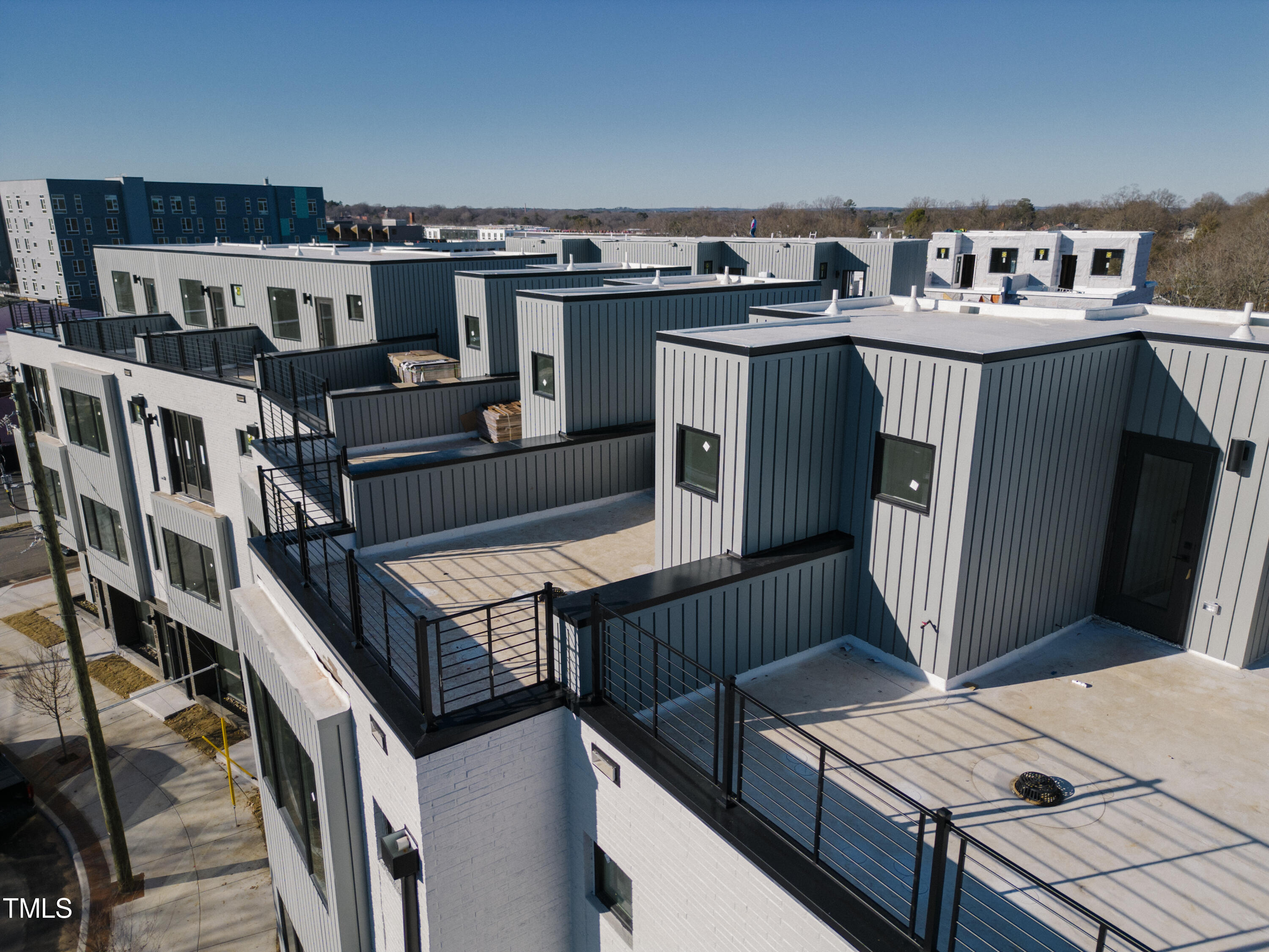 3001 Corbell Durham, NC 27701 - Photo 2 of 29 a roof deck with couches and wooden floor