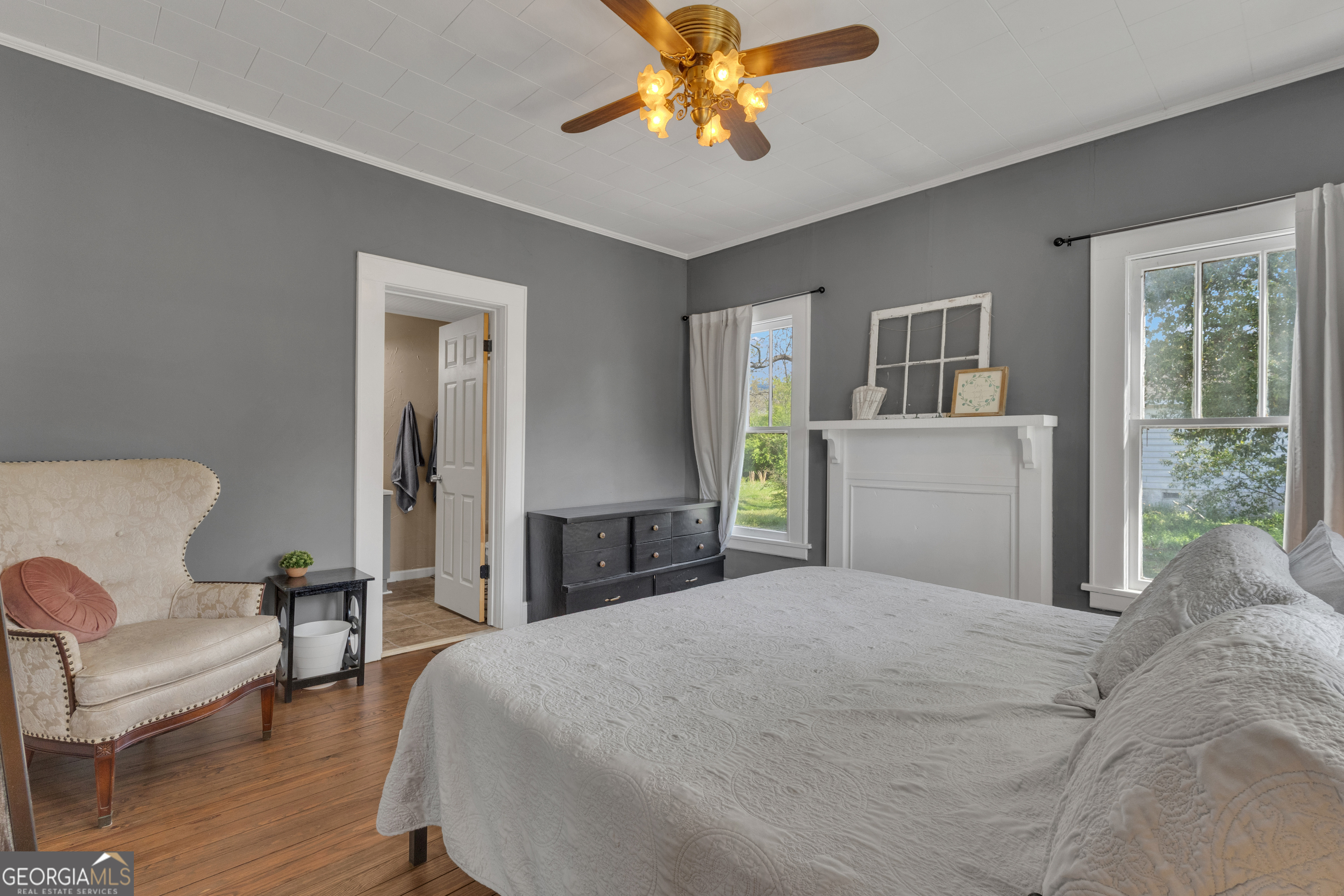 32 Post Street Grantville, GA 30220 - Photo 11 of 39 a bedroom with a bed couch and a window