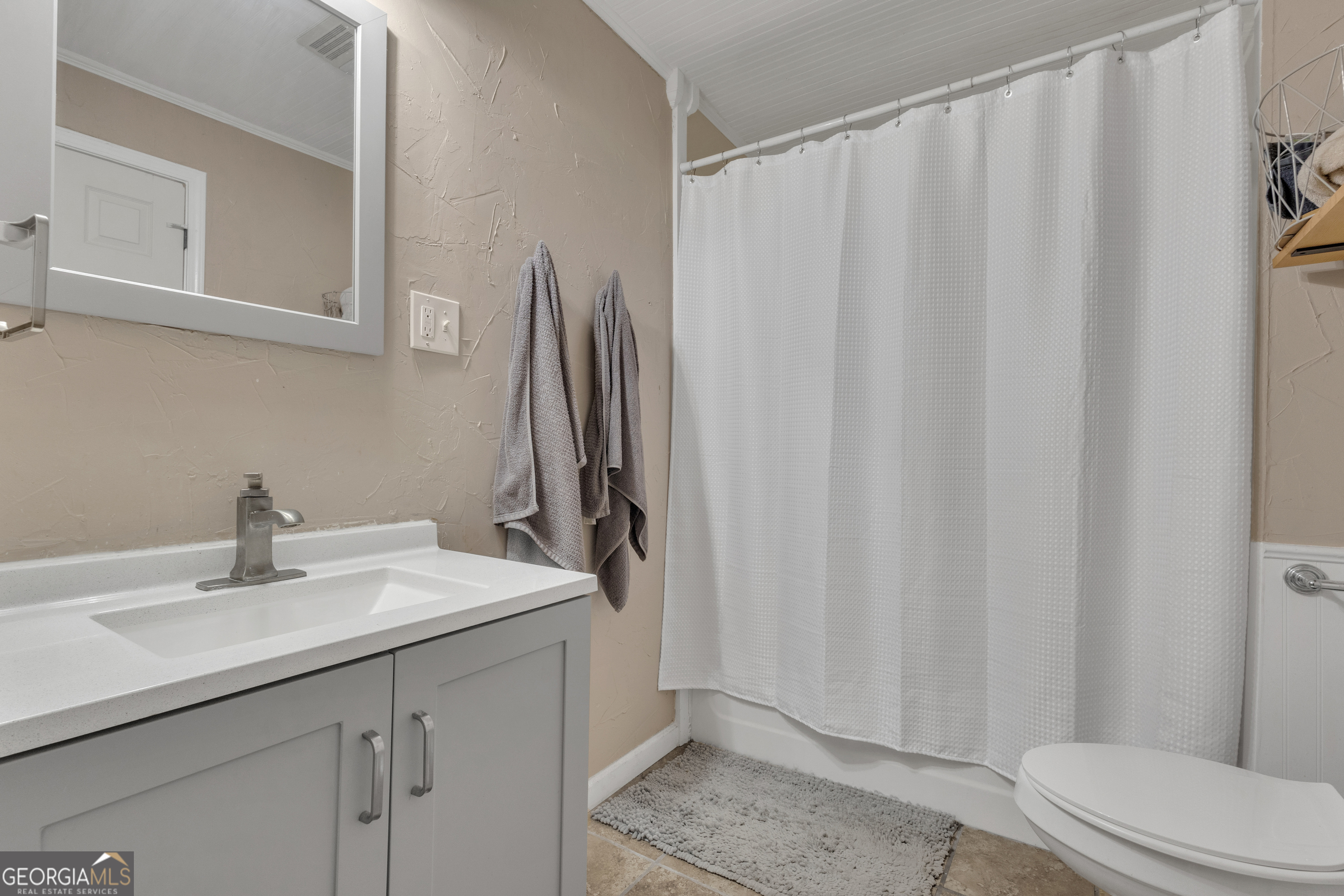 32 Post Street Grantville, GA 30220 - Photo 12 of 39 a bathroom with a sink a toilet and shower