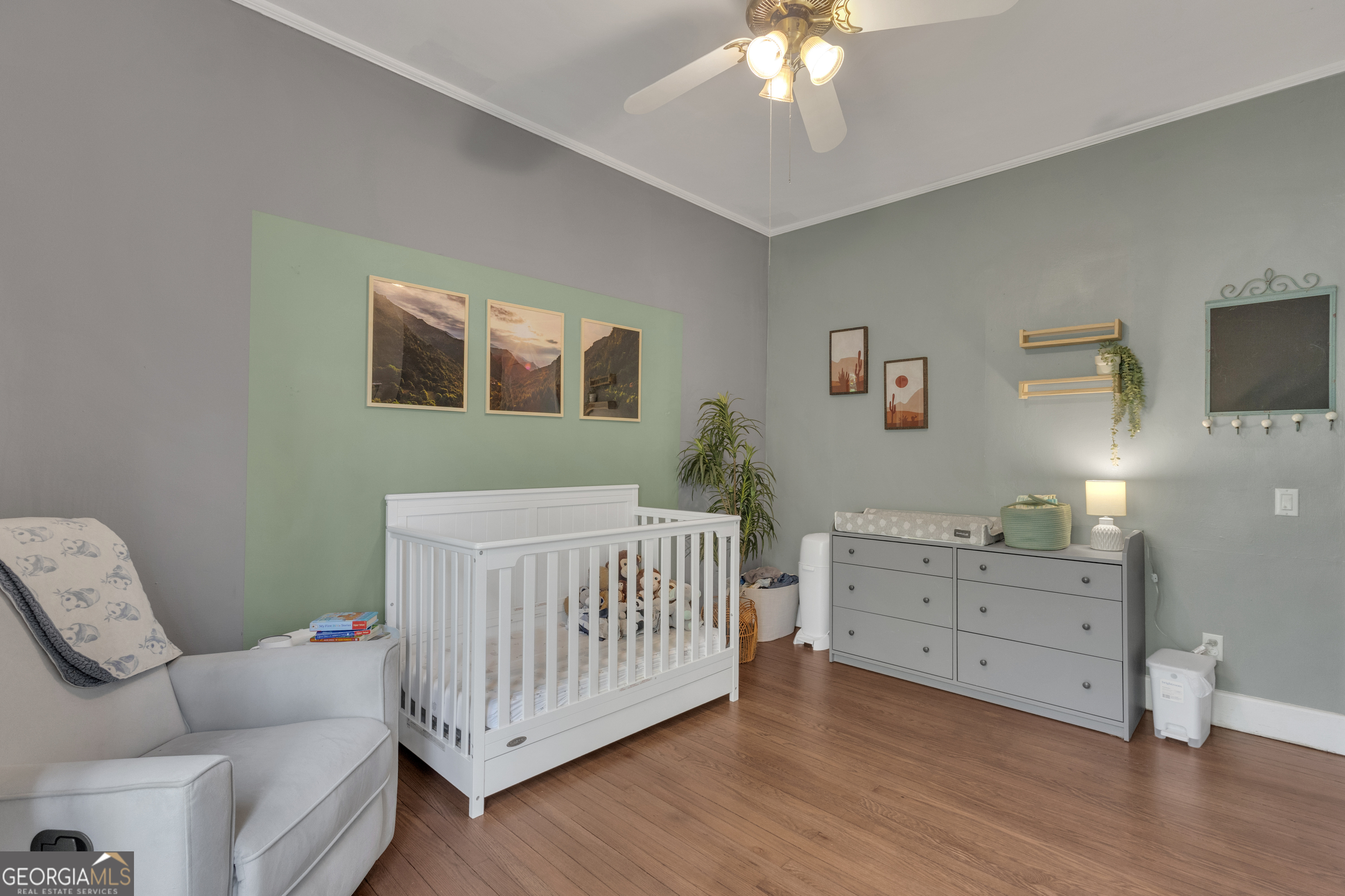 32 Post Street Grantville, GA 30220 - Photo 17 of 39 a bedroom with a bed and a chandelier