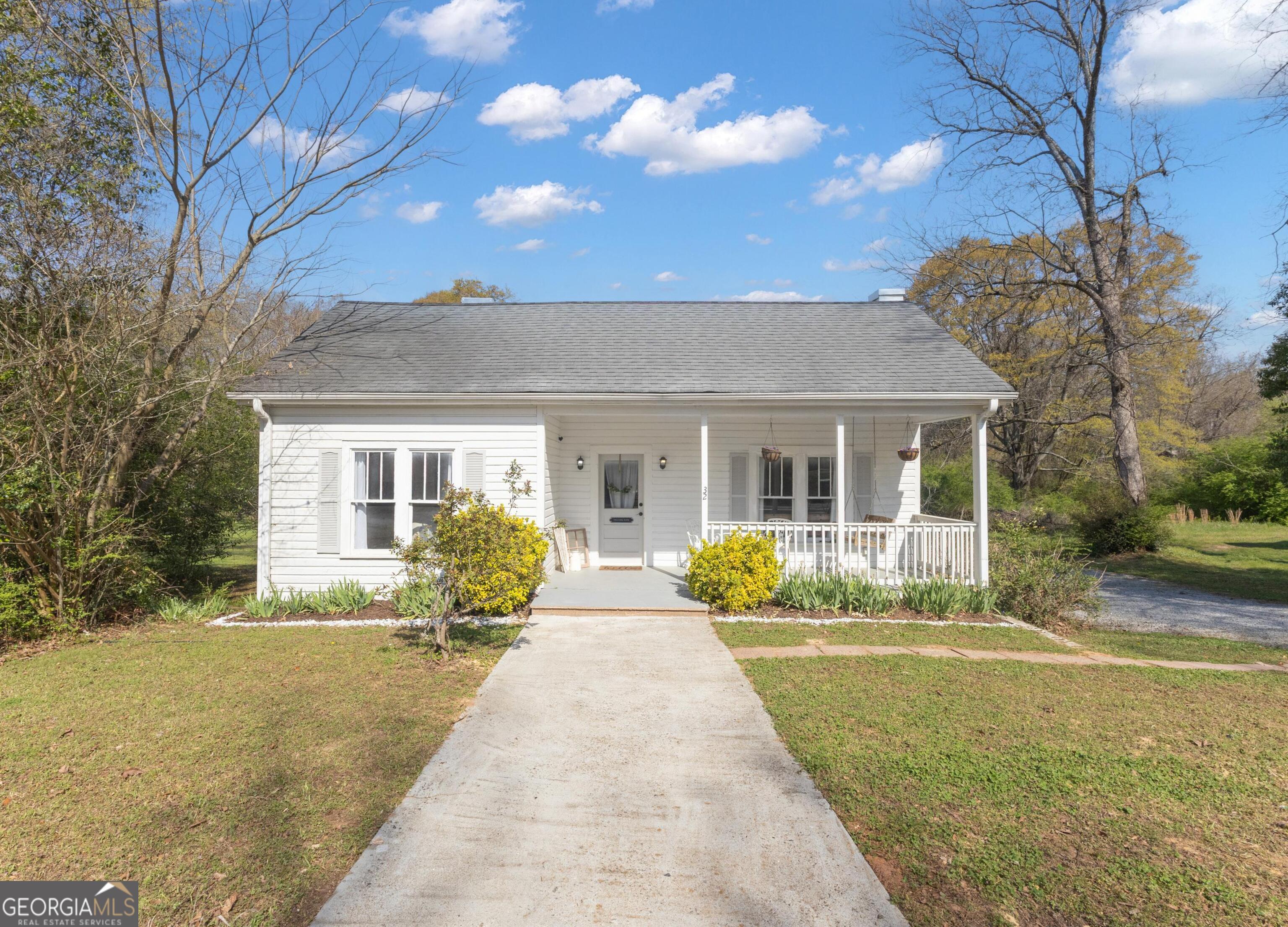 32 Post Street Grantville, GA 30220 - Photo 2 of 39 a front view of house with yard and green space