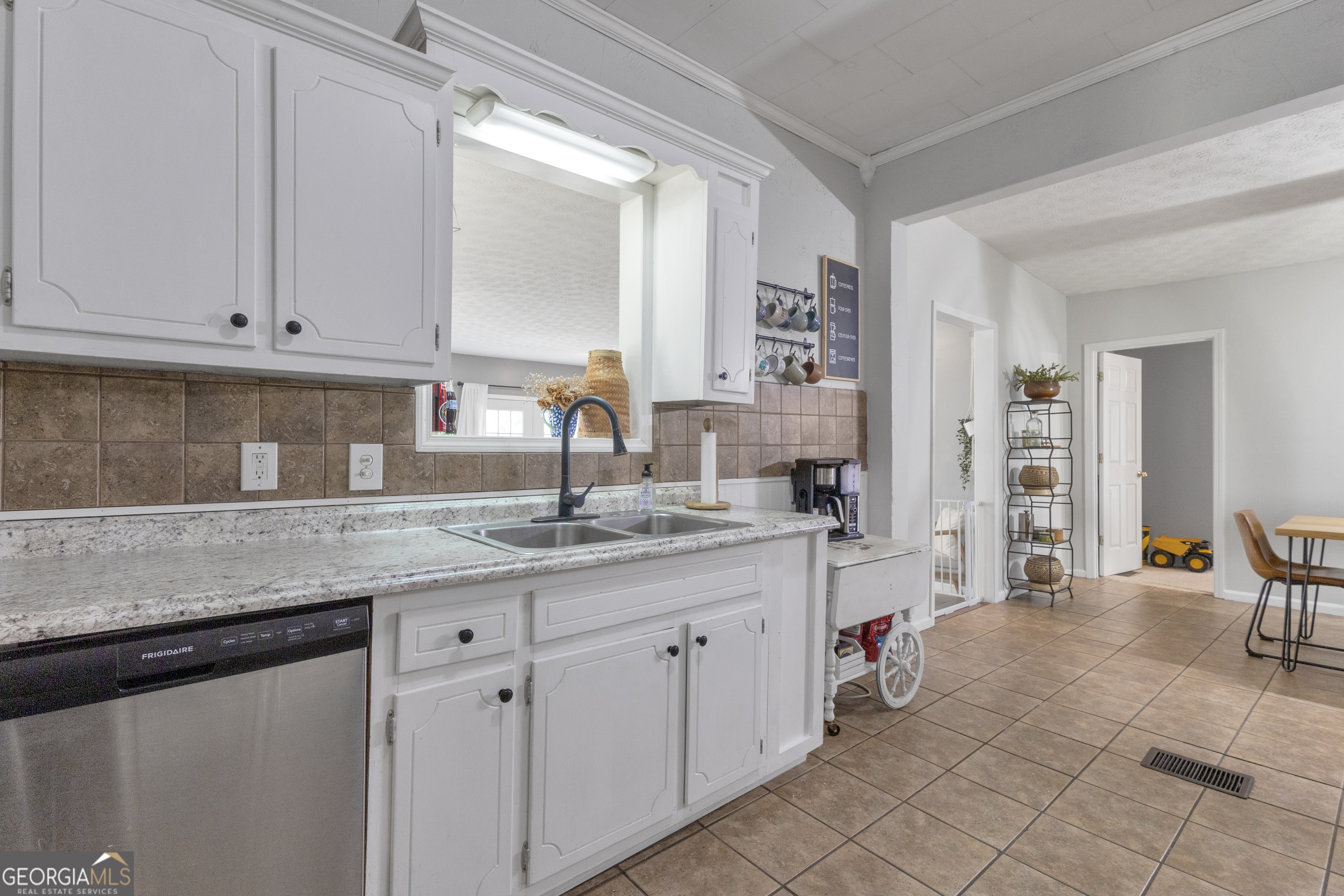 32 Post Street Grantville, GA 30220 - Photo 23 of 39 a kitchen with a sink and cabinets