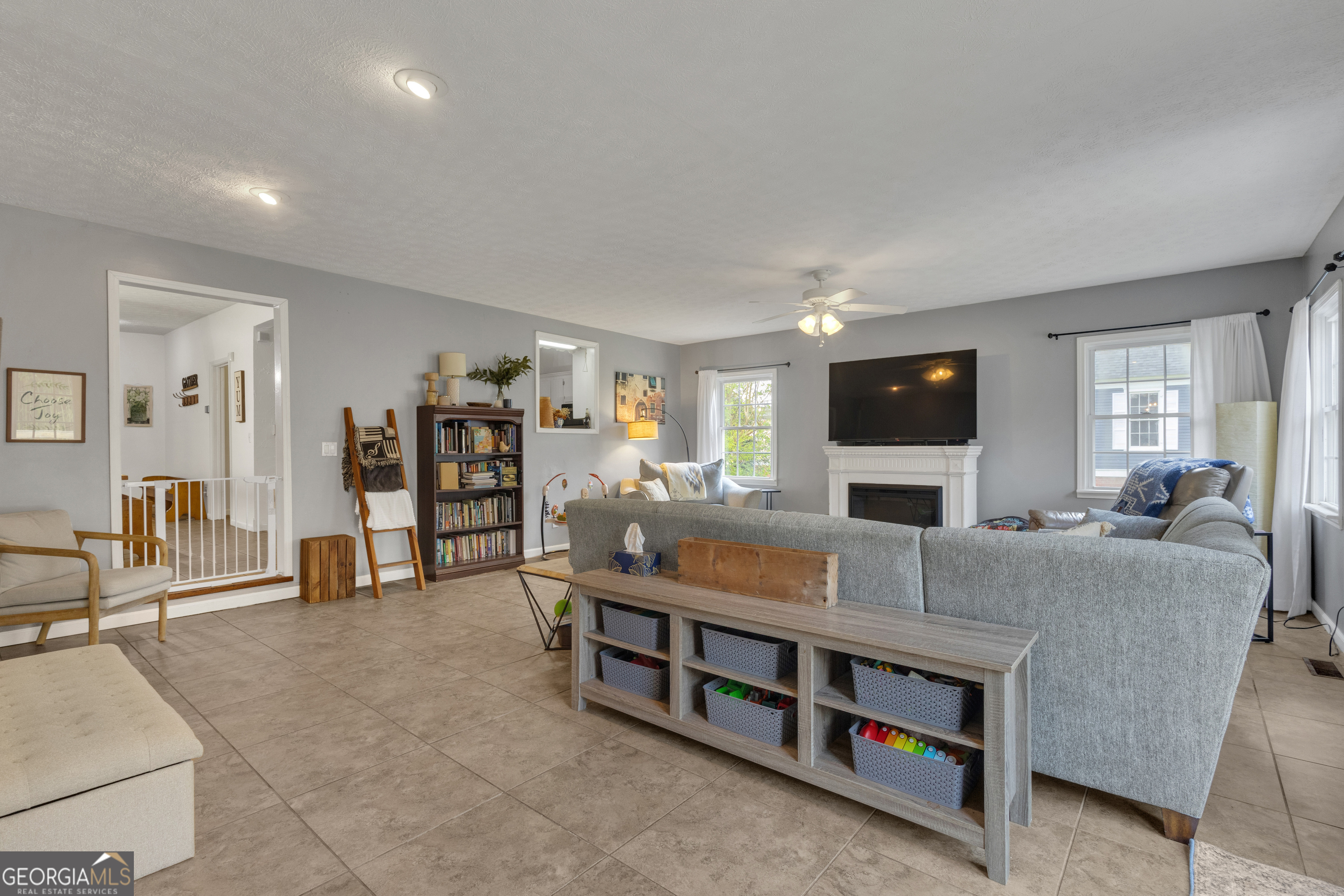 32 Post Street Grantville, GA 30220 - Photo 29 of 39 a living room with furniture and a flat screen tv
