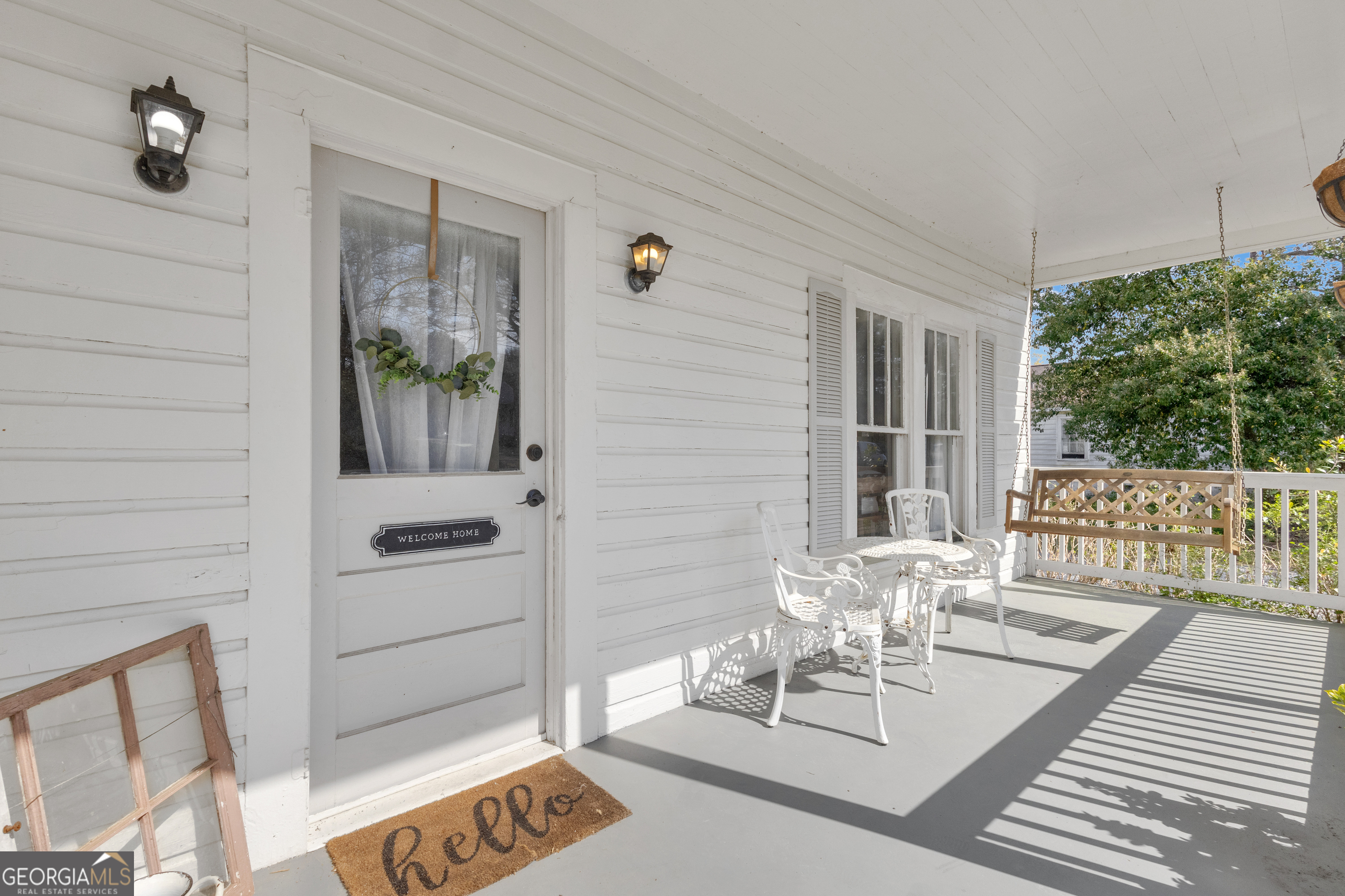 32 Post Street Grantville, GA 30220 - Photo 3 of 39 a view of a patio with table and chairs and potted plants