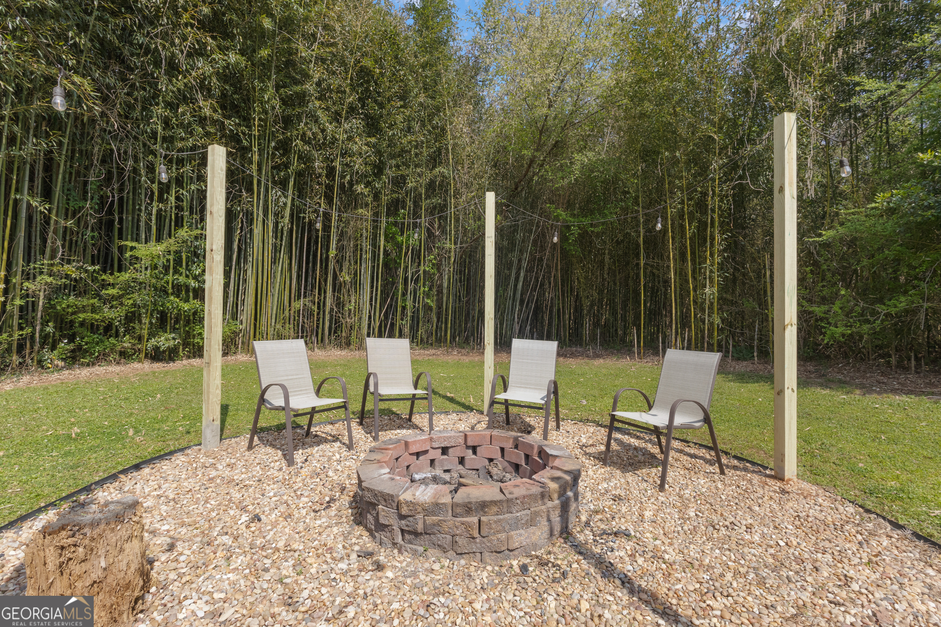 32 Post Street Grantville, GA 30220 - Photo 32 of 39 a view of an chairs and tables in the garden