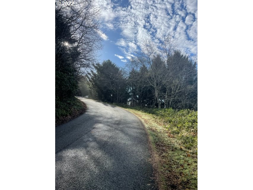 Pacific View Drive, Unit 81 Rockaway Beach, OR 97136 - Photo 3 of 11 a view of a yard with trees