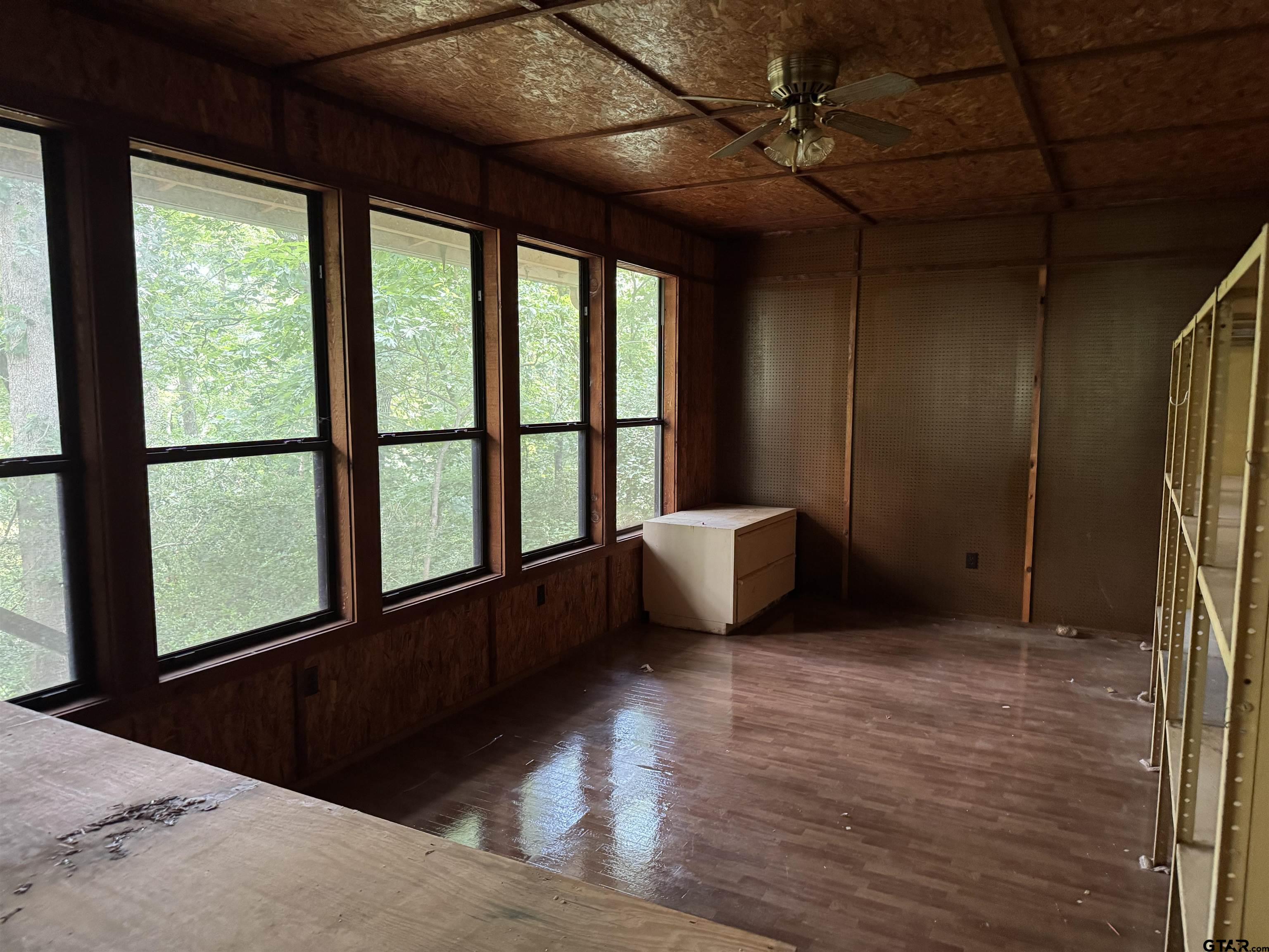 289 Llano Bend Holly Lake Ranch, TX 75765 - Photo 8 of 48 a view of an empty room with a window