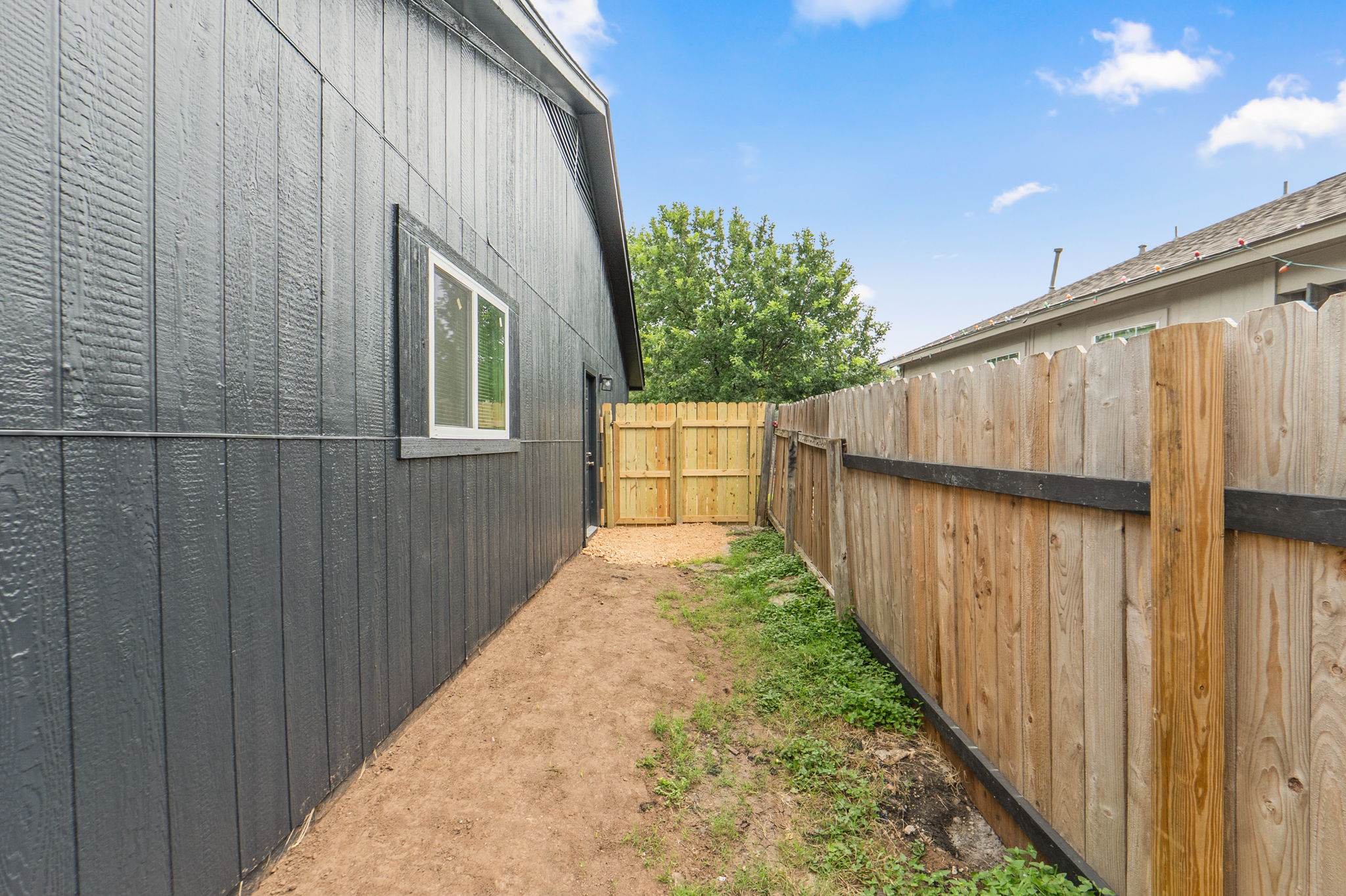 8203 Colony Loop Drive Austin, TX 78724 - Photo 19 of 38 Secure yard access and privacy fence provide peace of mind.