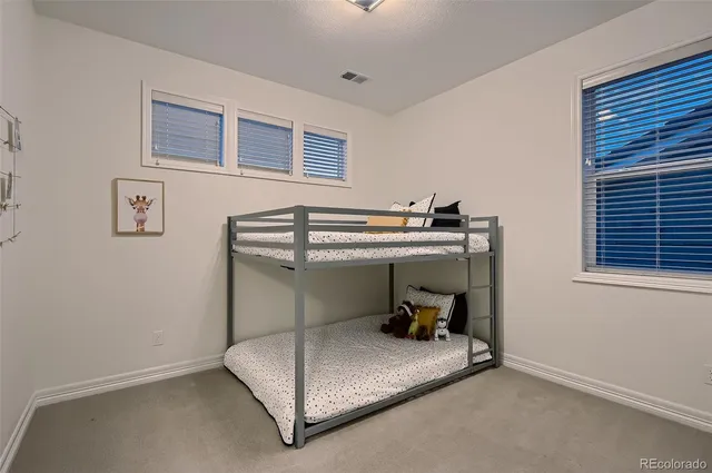 a room with a bed and window