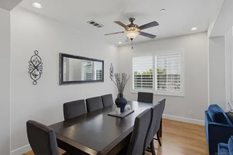 a view of a dining room with furniture window and wooden floor