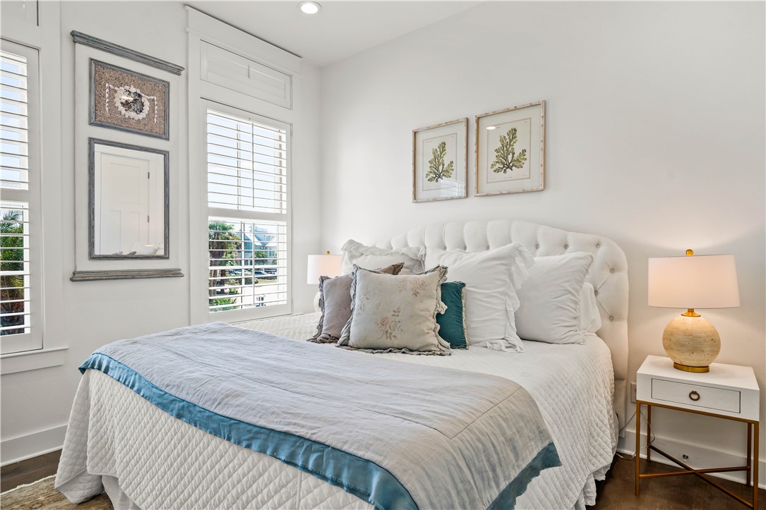 200 Round Road Port Aransas, TX 78373 - Photo 13 of 38 a bedroom with bed and a window