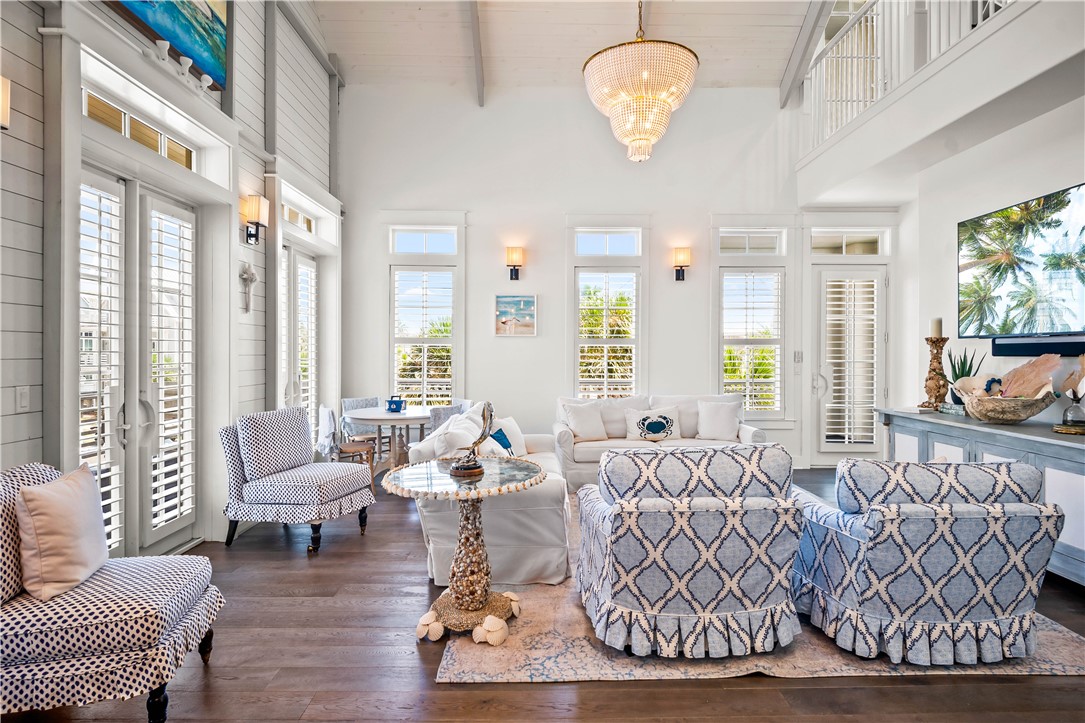 200 Round Road Port Aransas, TX 78373 - Photo 6 of 38 a living room with furniture chandelier and a large window