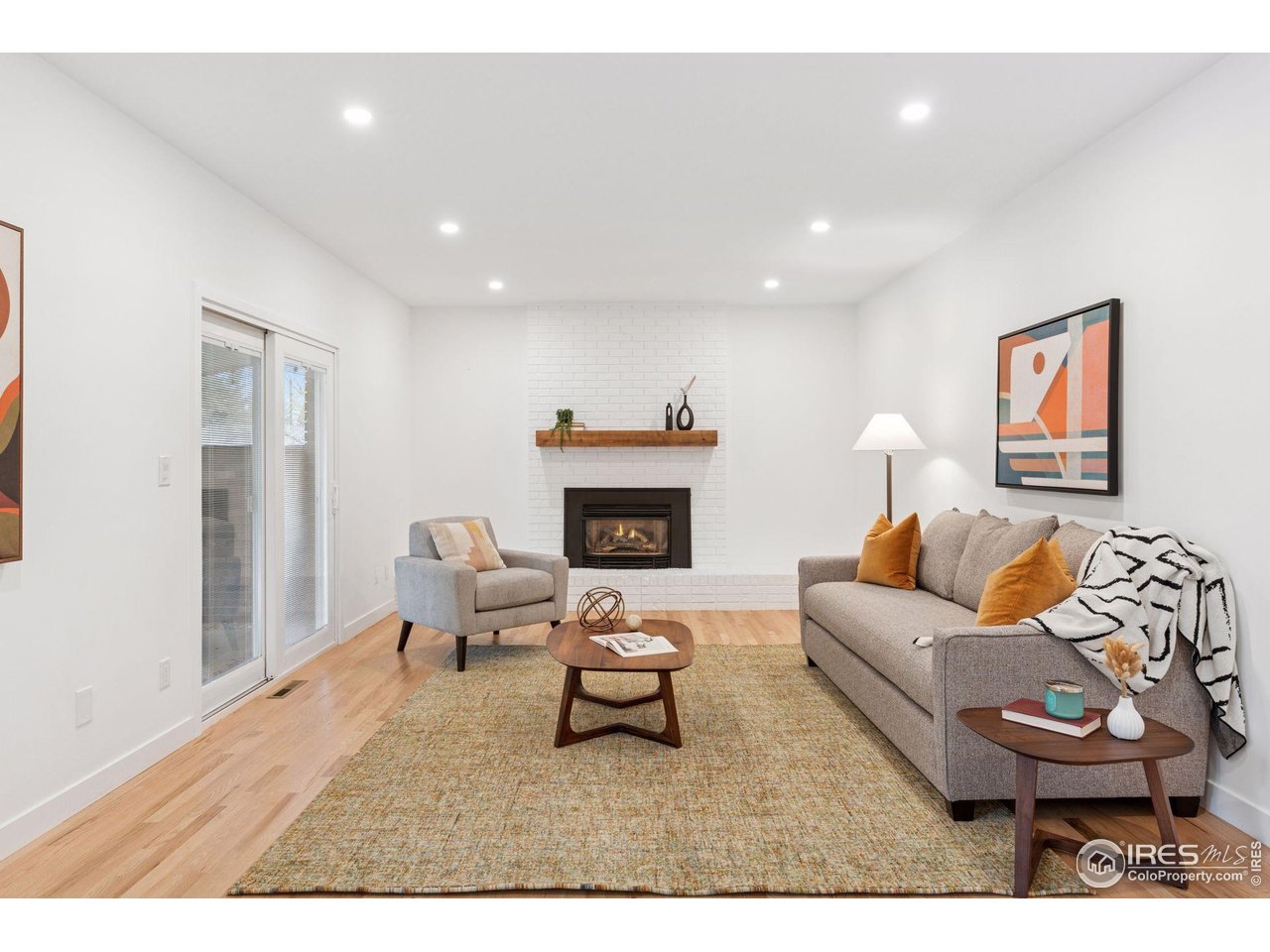 6916 Hunter Place Boulder, CO 80301 - Photo 11 of 40 Living room off the kitchen with sliding doors to the back patio and beautiful fenced yard.