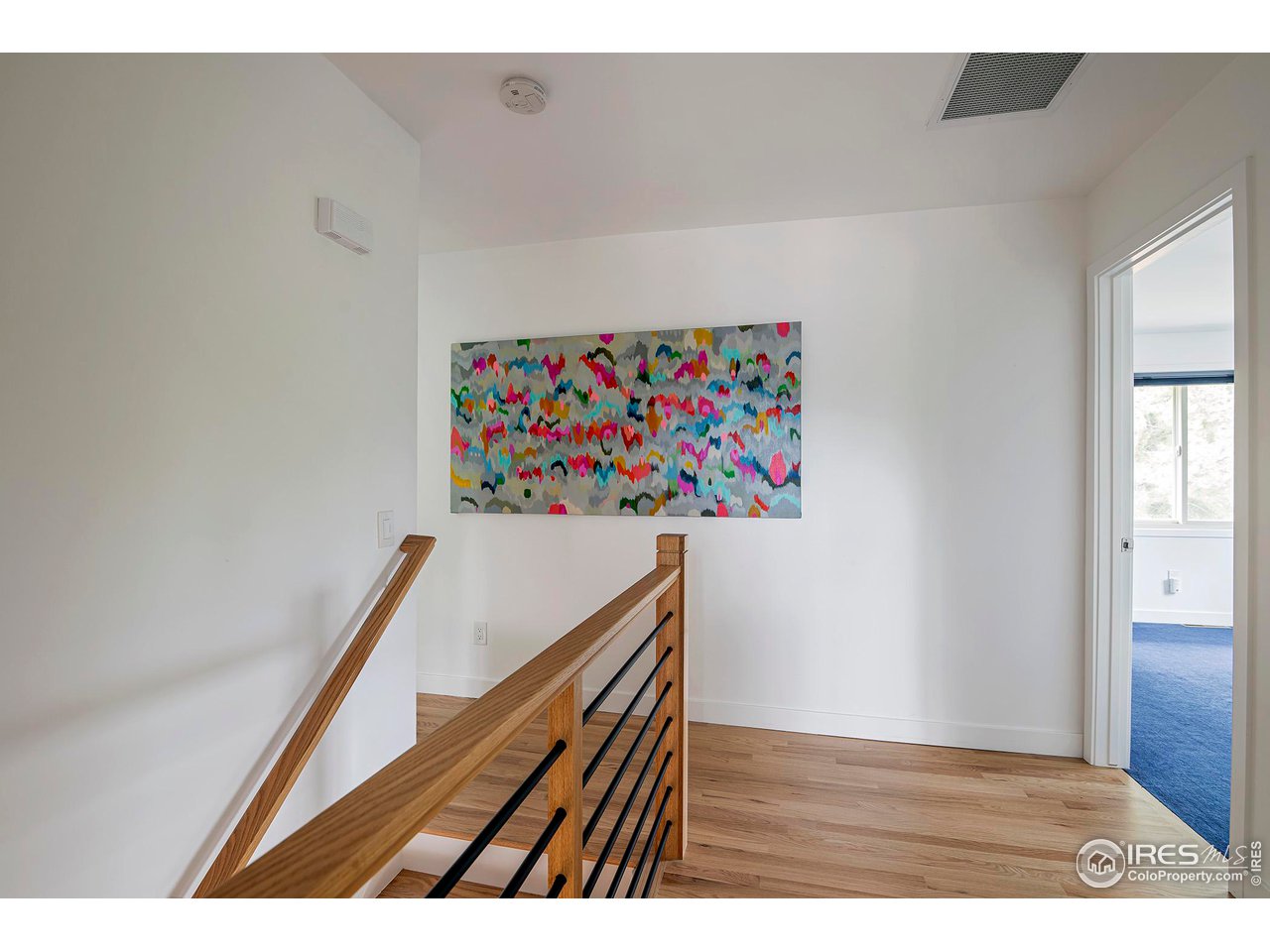 6916 Hunter Place Boulder, CO 80301 - Photo 16 of 40 Modern stair railing is a lovely touch, headed up to the upper level with 4 bedrooms and 2 baths.