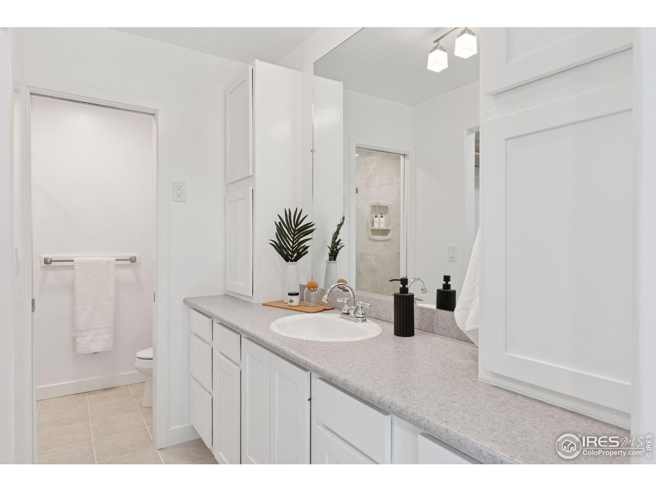 6916 Hunter Place Boulder, CO 80301 - Photo 19 of 40 Primary bathroom with walk-in closet and oversized shower.