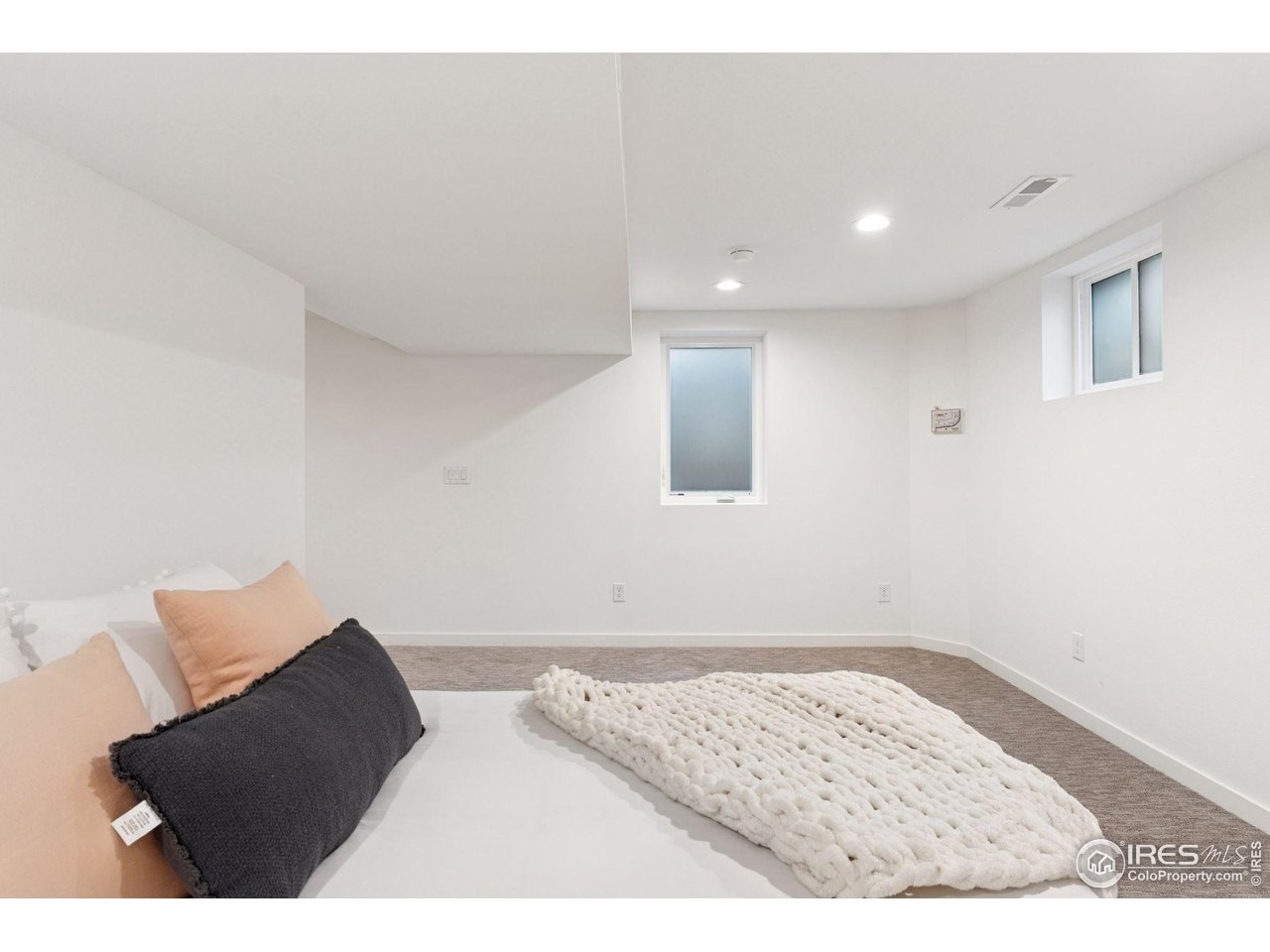 6916 Hunter Place Boulder, CO 80301 - Photo 32 of 40 Lower level guest room with conforming windows.