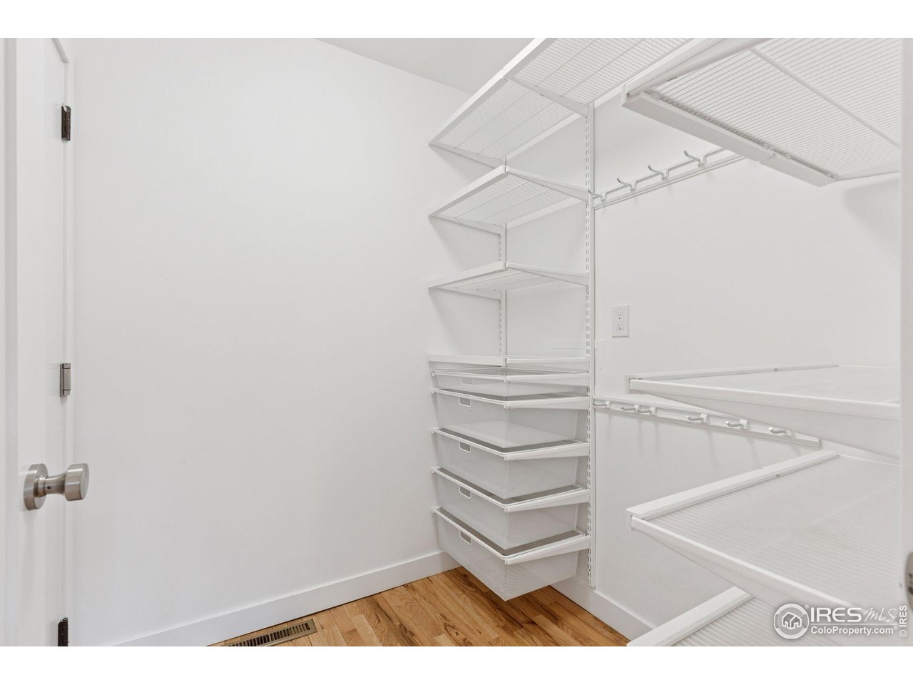 6916 Hunter Place Boulder, CO 80301 - Photo 39 of 40 Mudroom with Elfa storage off attached garage.