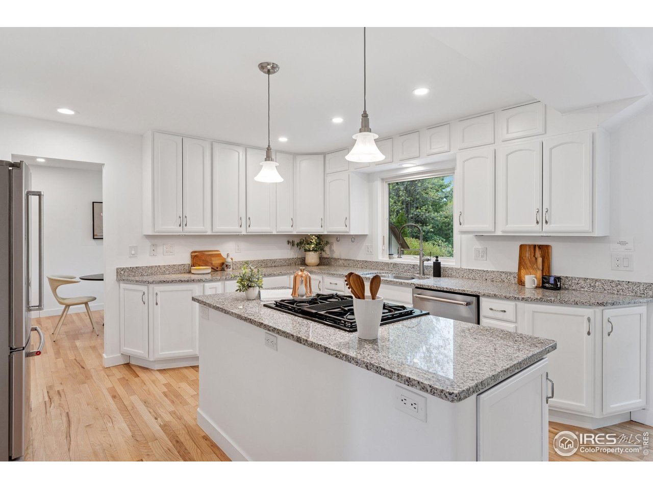 6916 Hunter Place Boulder, CO 80301 - Photo 8 of 40 Kitchen with formal dining room provides for wonderful dinner party options.