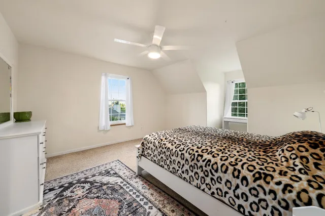 a kitchen with stainless steel appliances granite countertop a stove top oven a sink dishwasher a refrigerator and a microwave oven with wooden floor