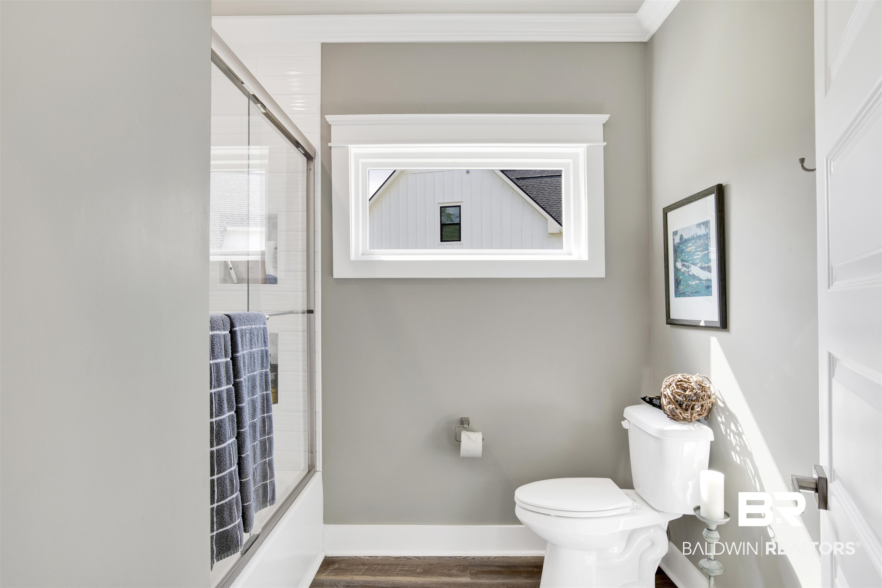 21621 Veranda Boulevard Fairhope, AL 36532 - Photo 10 of 51 Full bathroom with crown molding, toilet, baseboards, wood finished floors, and bath / shower combo with glass door
