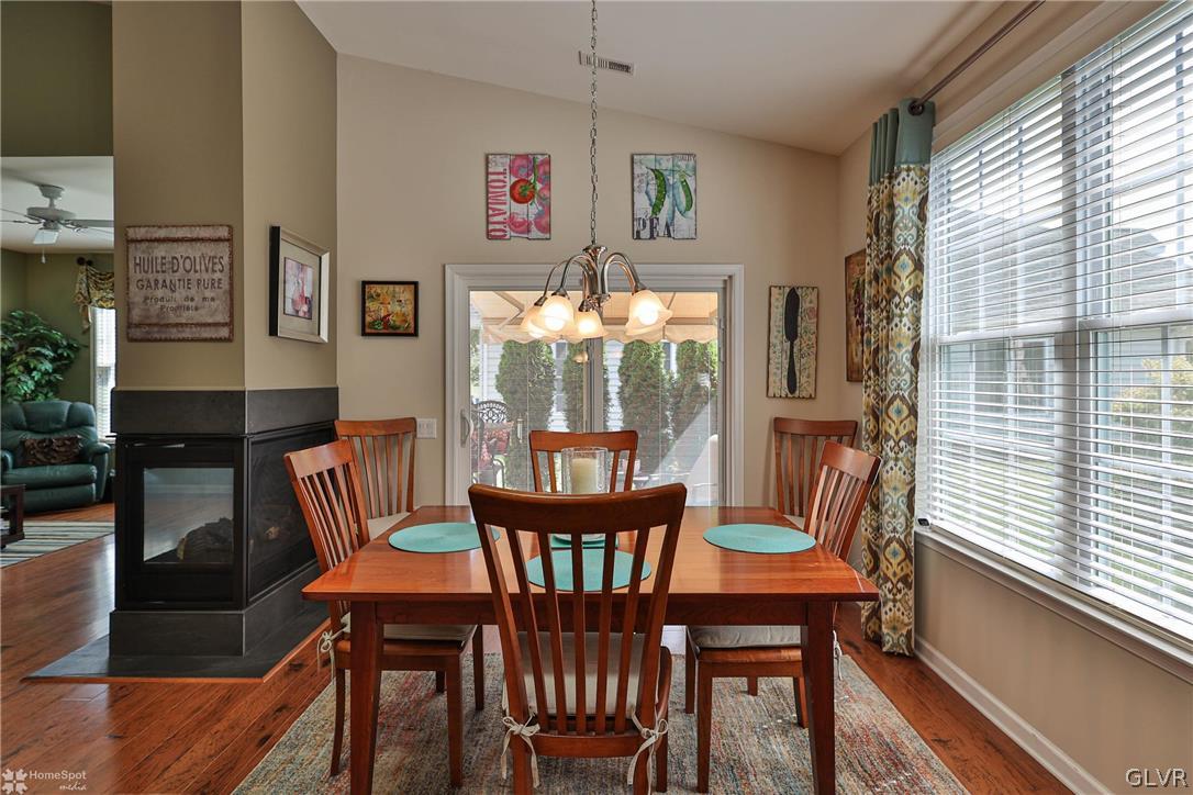 1015 Declaration Drive Bethlehem, PA 18017 - Photo 20 of 33 a view of a dining room with furniture a chandelier and wooden floor