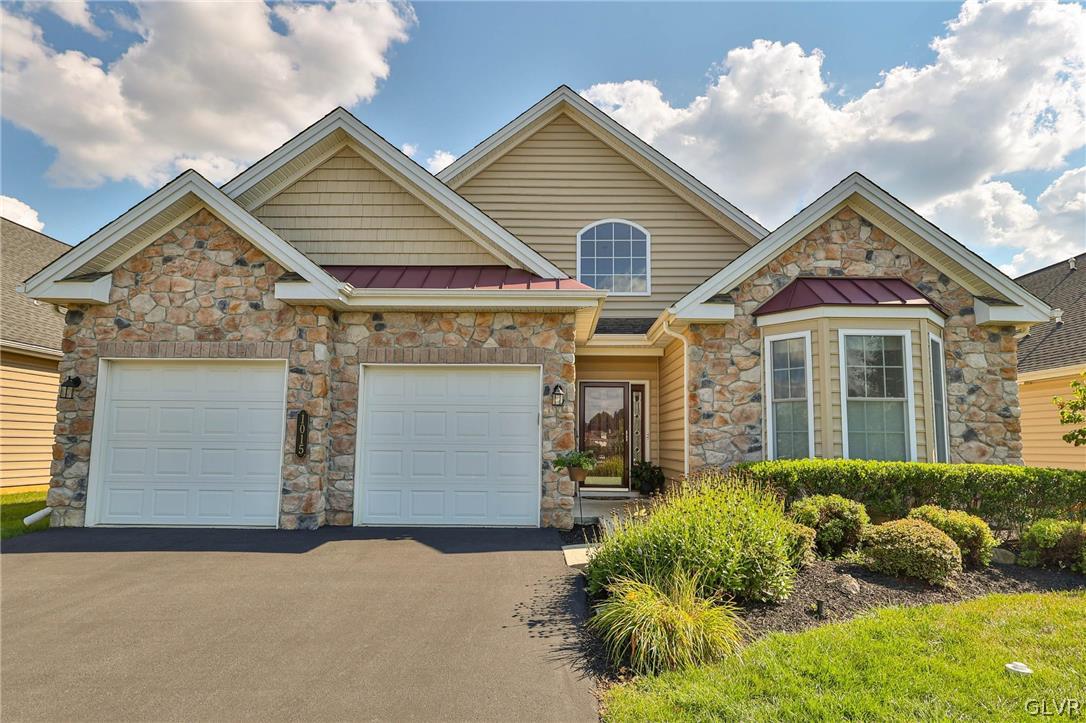 1015 Declaration Drive Bethlehem, PA 18017 - Photo 2 of 33 a front view of a house with a yard and garage