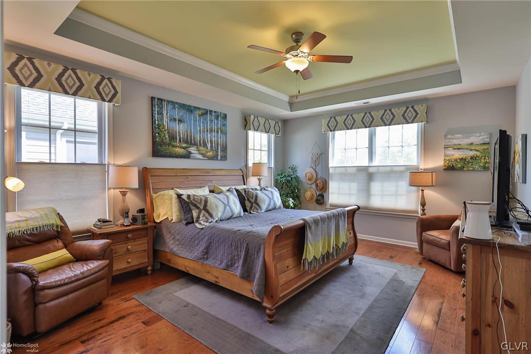 1015 Declaration Drive Bethlehem, PA 18017 - Photo 24 of 33 a living room with a bed furniture flat screen tv and windows