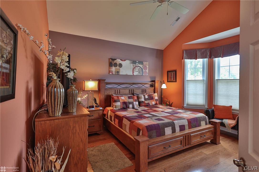 1015 Declaration Drive Bethlehem, PA 18017 - Photo 5 of 33 a bedroom with a large bed a flat tv screen and a dresser