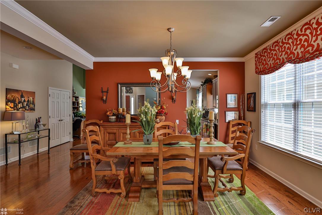 1015 Declaration Drive Bethlehem, PA 18017 - Photo 9 of 33 a view of a dining room with furniture window and wooden floor