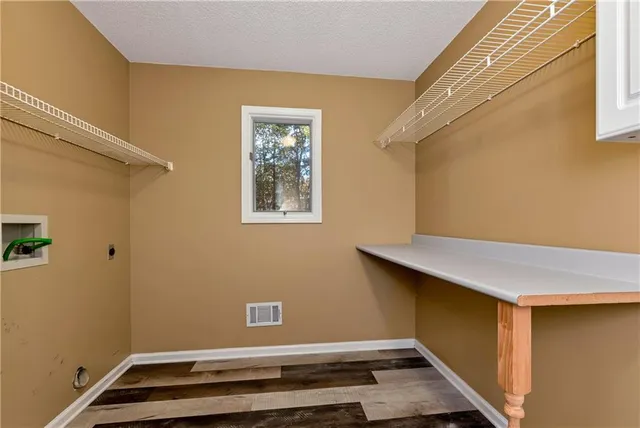 a spacious bathroom with a bathtub double sink and large mirror