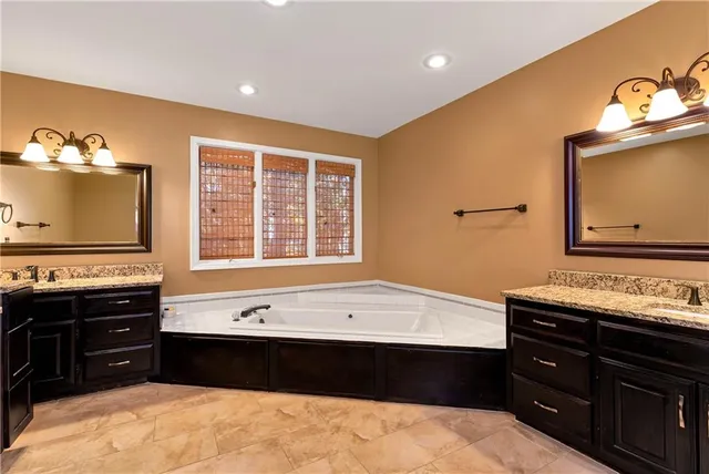 a view of a chandelier fan and entryway