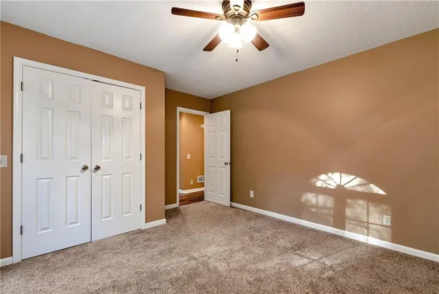 a view of a hallway with a room