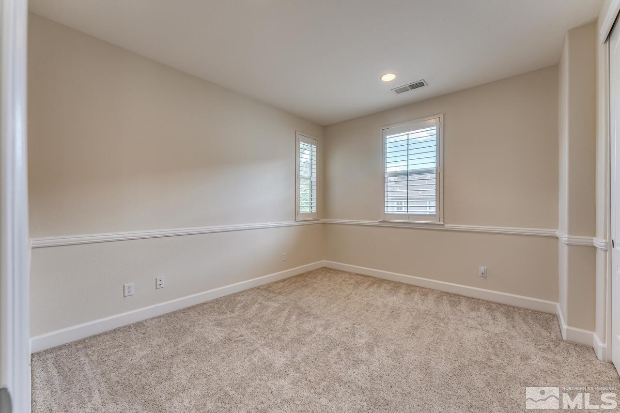 7625 Stone Bluff Way Reno, NV 89523 - Photo 20 of 32 an empty room with windows