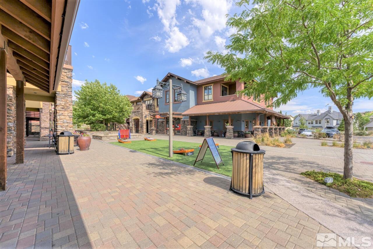 7625 Stone Bluff Way Reno, NV 89523 - Photo 26 of 32 a front view of a house with a yard table and chairs