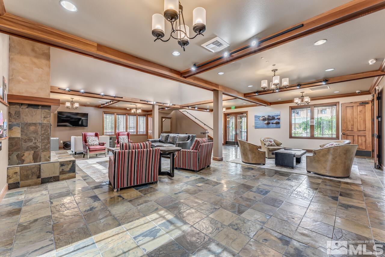 7625 Stone Bluff Way Reno, NV 89523 - Photo 29 of 32 a living room with lots of furniture and lots of furniture