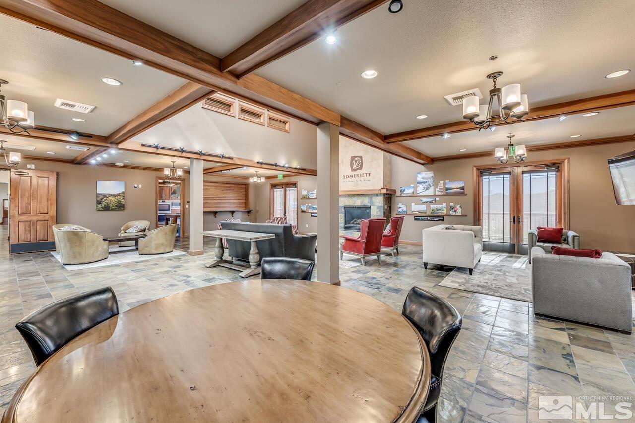 7625 Stone Bluff Way Reno, NV 89523 - Photo 31 of 32 a living room with furniture and a chandelier