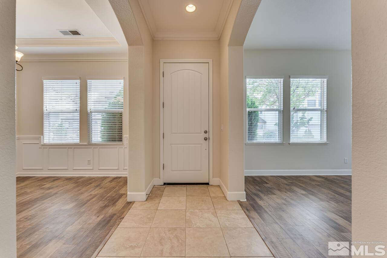 7625 Stone Bluff Way Reno, NV 89523 - Photo 5 of 32 an empty room with wooden floor and windows