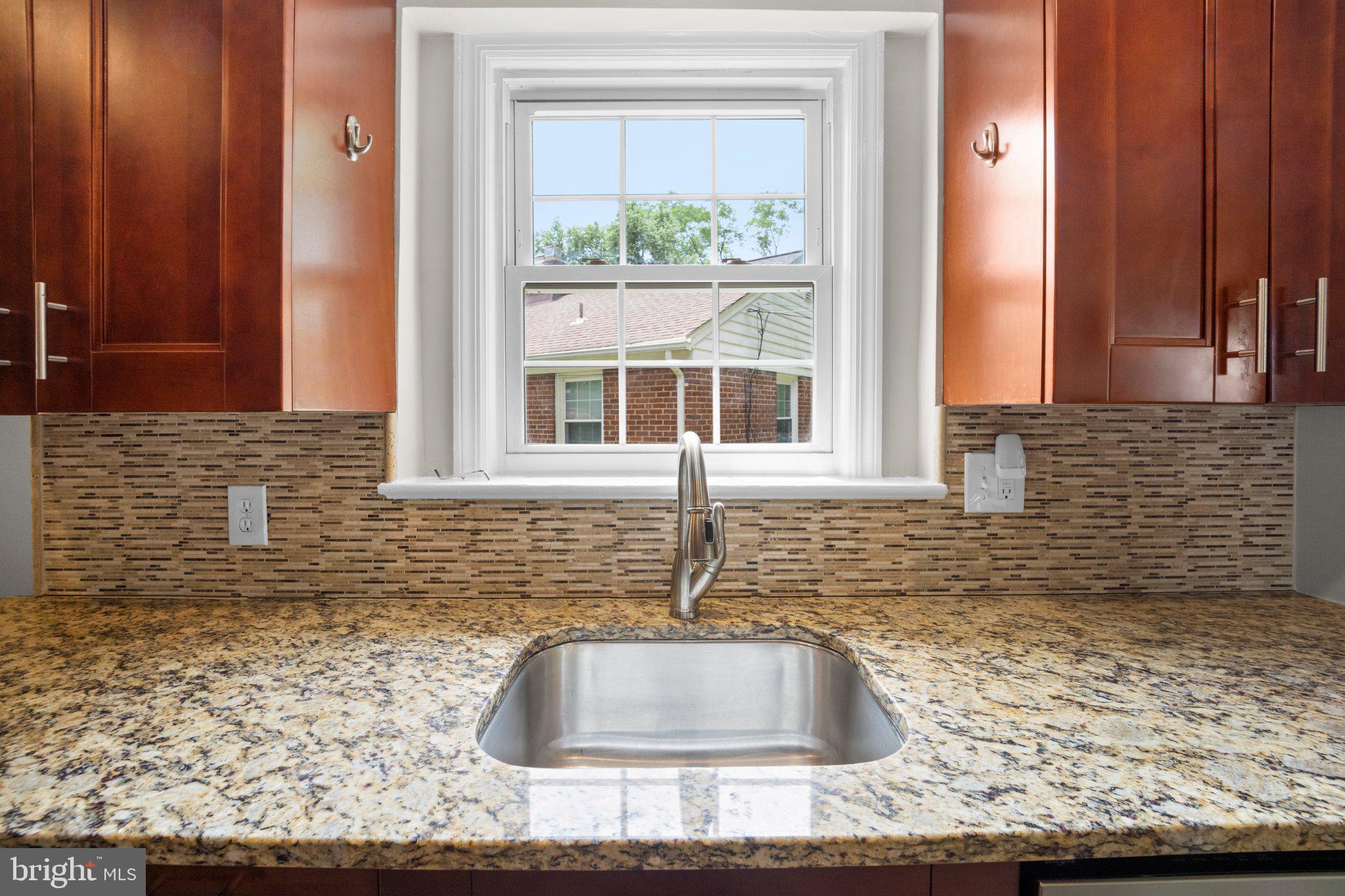 1812 Florin Street Silver Spring, MD 20902 - Photo 12 of 38 a bathroom with a sink and a window