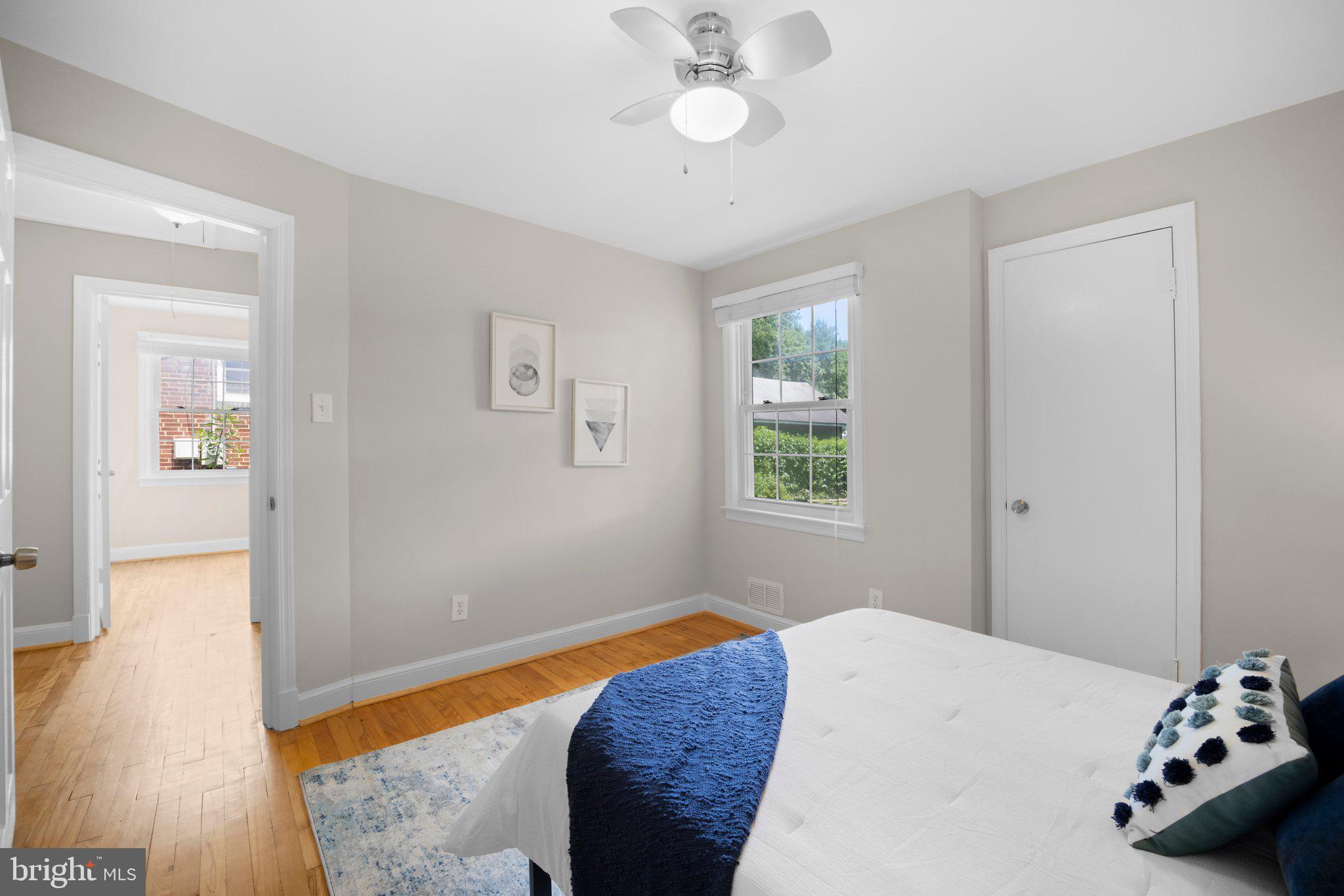 1812 Florin Street Silver Spring, MD 20902 - Photo 14 of 38 a bedroom with a bed and wooden floor