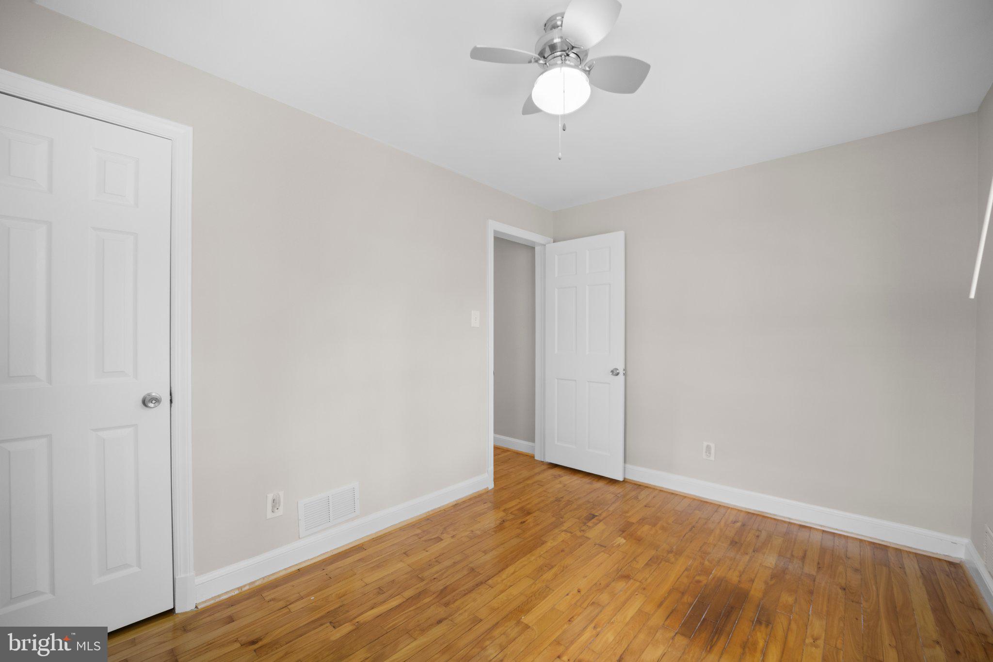 1812 Florin Street Silver Spring, MD 20902 - Photo 17 of 38 a view of an empty room with wooden floor