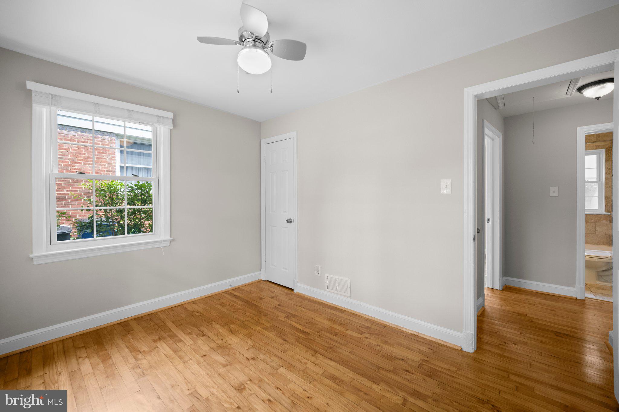 1812 Florin Street Silver Spring, MD 20902 - Photo 18 of 38 a view of empty room with wooden floor and fan
