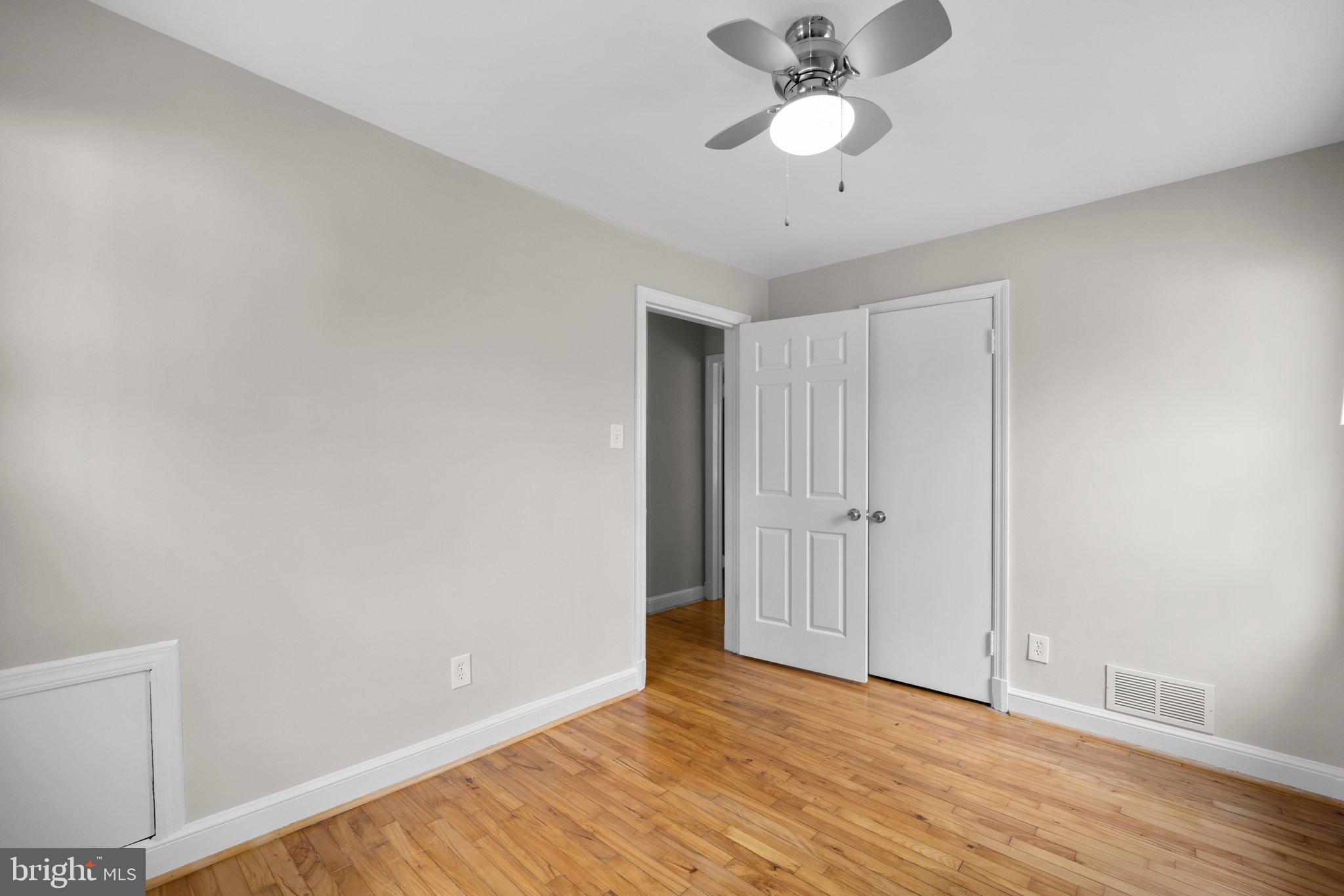 1812 Florin Street Silver Spring, MD 20902 - Photo 21 of 38 a view of an empty room with wooden floor