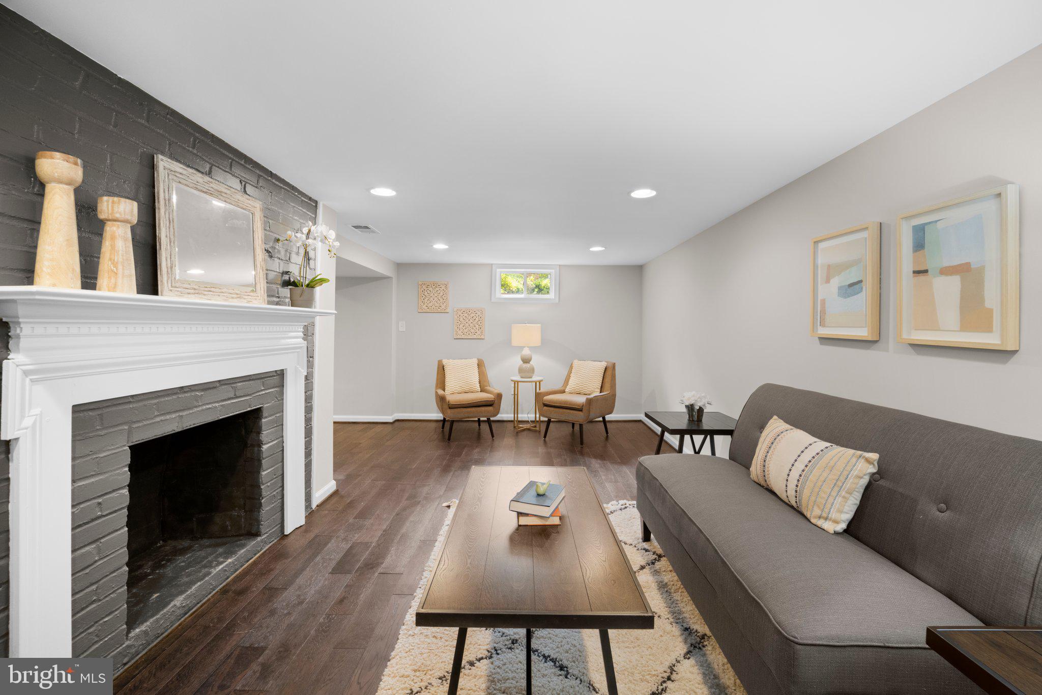 1812 Florin Street Silver Spring, MD 20902 - Photo 28 of 38 a living room with furniture and a fireplace
