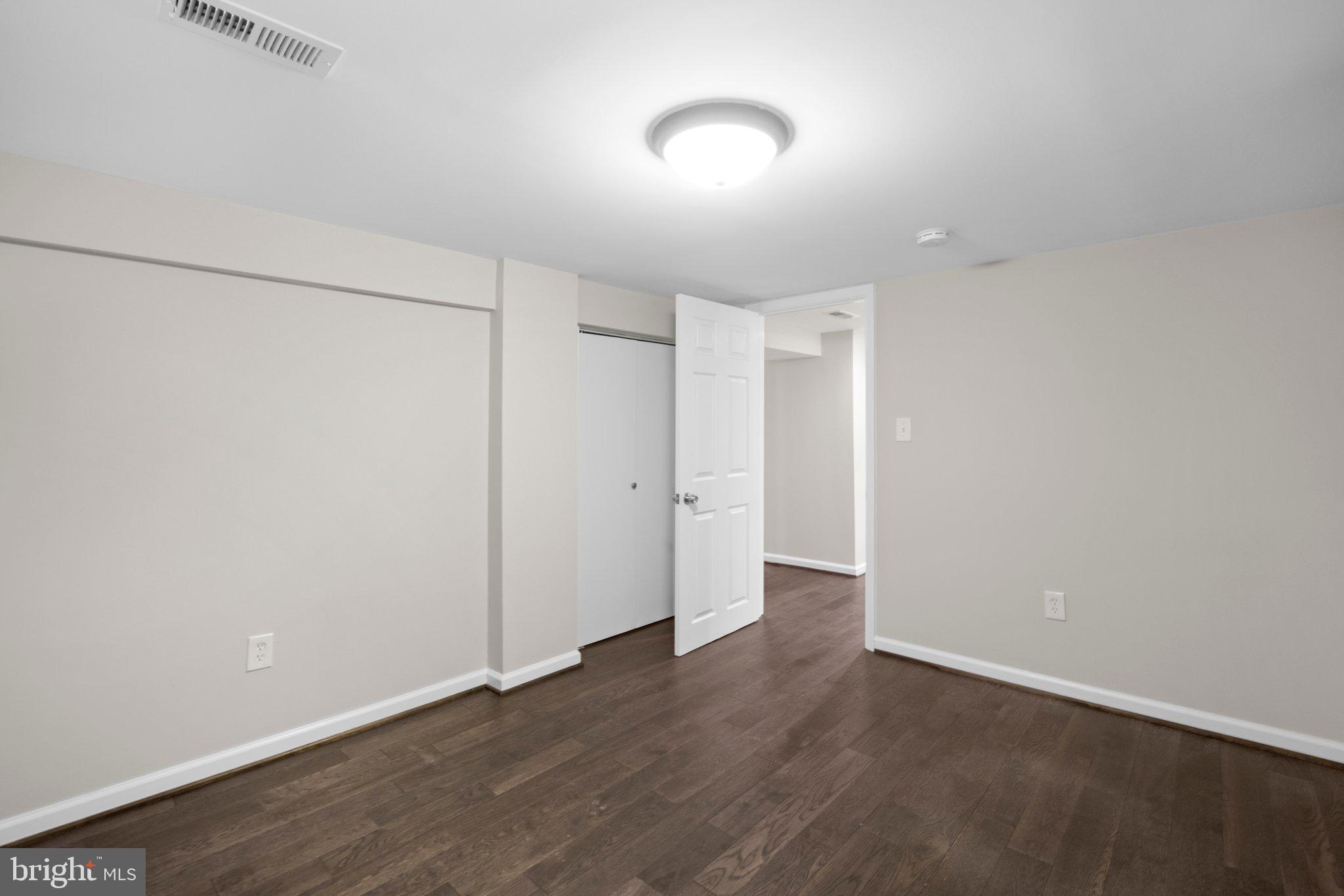 1812 Florin Street Silver Spring, MD 20902 - Photo 29 of 38 wooden floor in an empty room