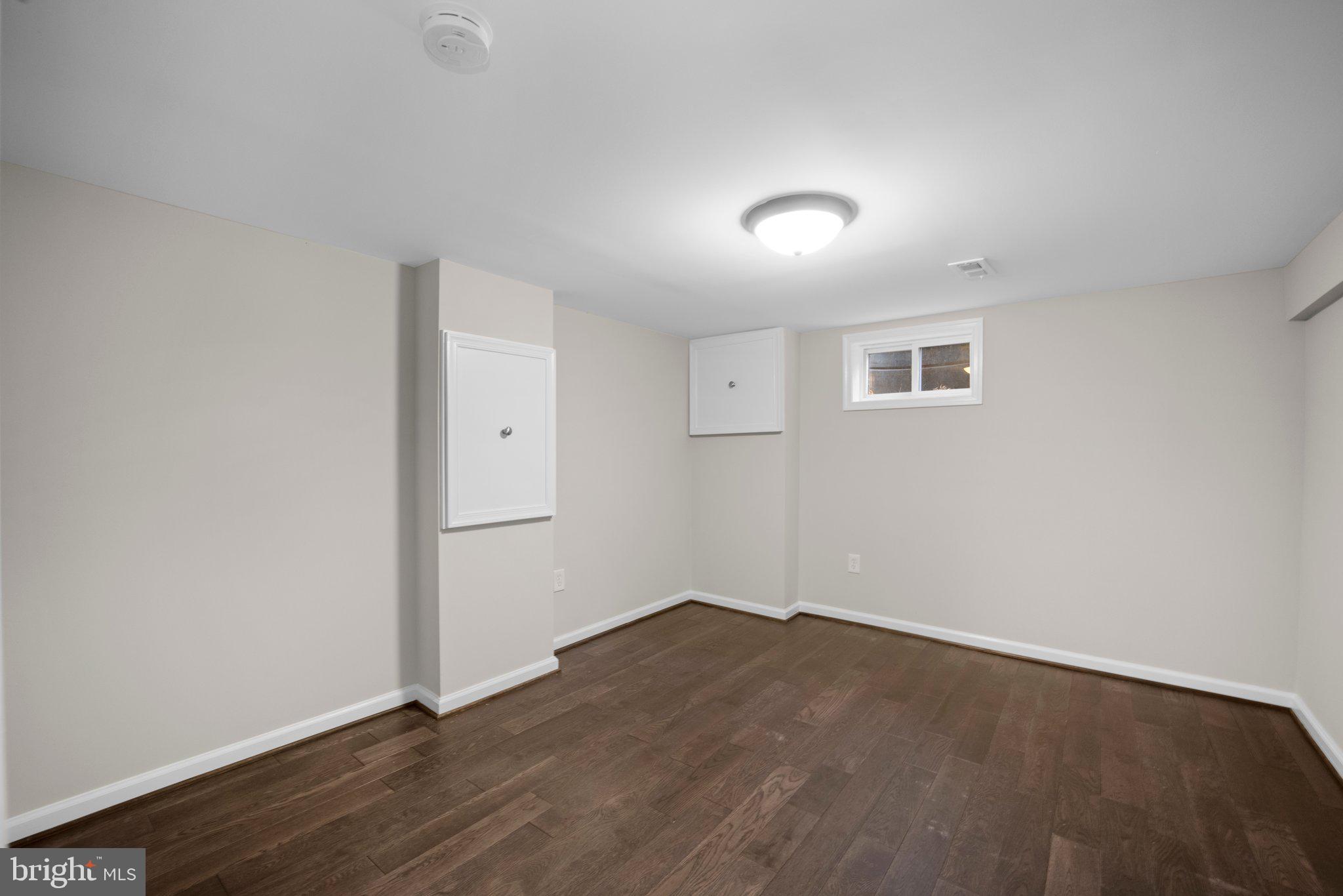 1812 Florin Street Silver Spring, MD 20902 - Photo 30 of 38 an empty room with wooden floor and windows