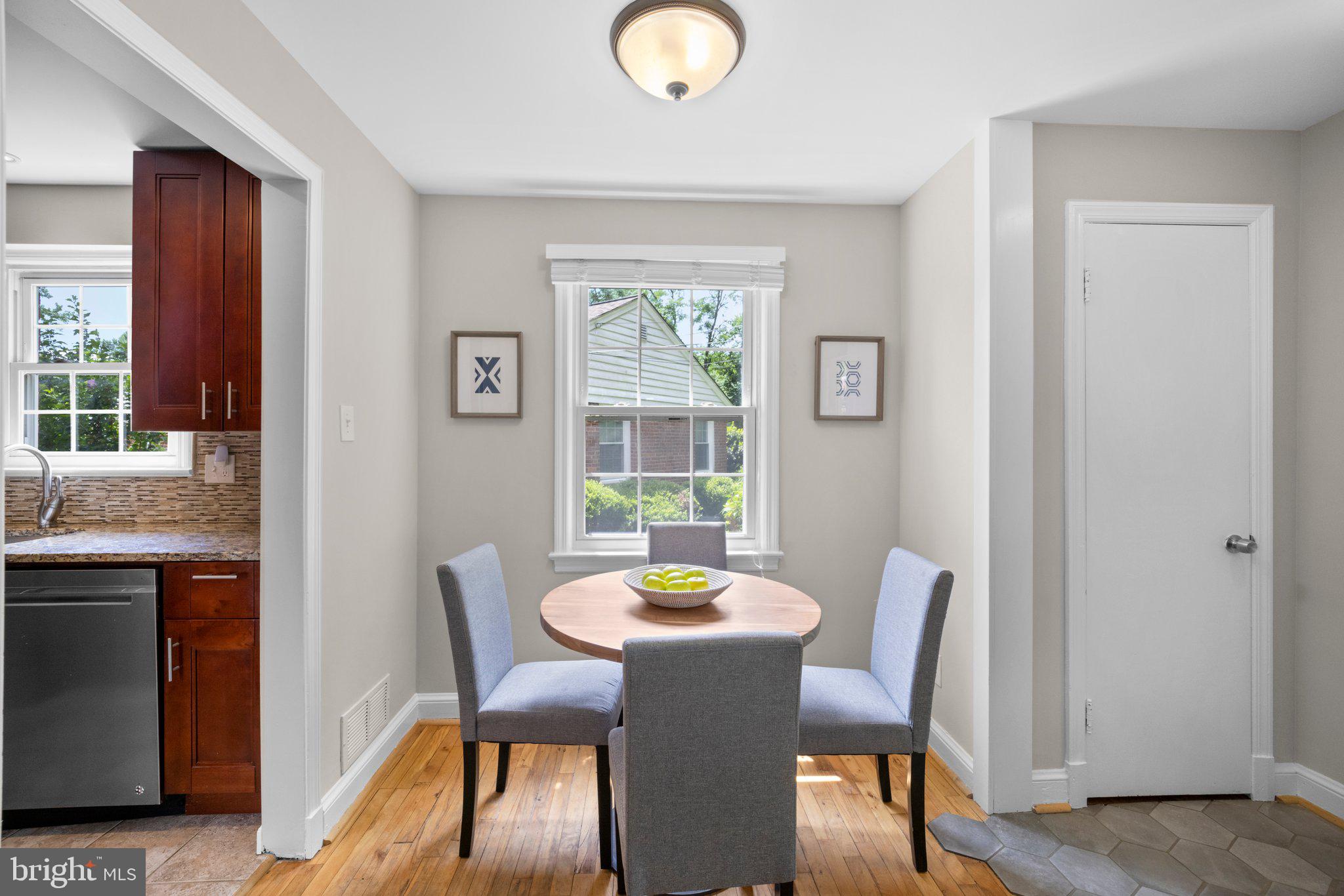 1812 Florin Street Silver Spring, MD 20902 - Photo 9 of 38 a view of a dining room with furniture window and wooden floor